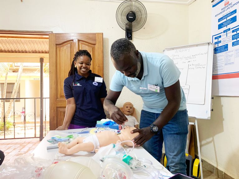 Practising emergency resuscitation on a doll in Uganda