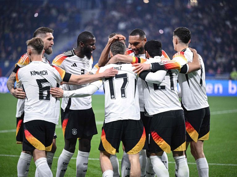 German players celebrate during preparations for the World Cup. 