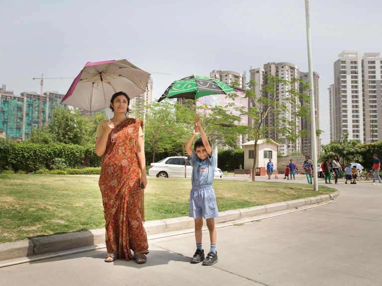 Residents of an energy-efficient housing development in Noida, south of Delhi. Residents of an energy-efficient housing development in Noida, south of Delhi.