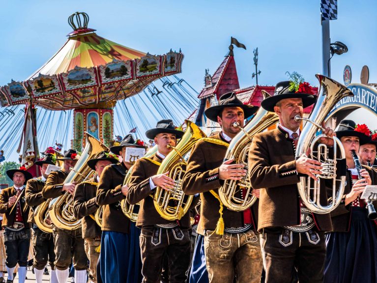 Traditional brass bands parade to the “Wiesn” grounds for the opening of the fair. Traditional brass bands parade to the “Wiesn” grounds for the opening of the fair.