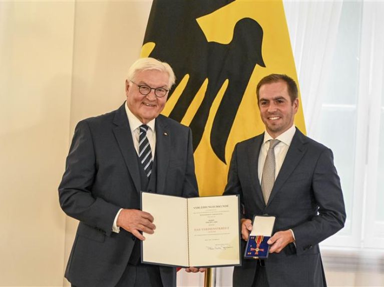 Frank-Walter Steinmeier (left) and Philipp Lahm Frank-Walter Steinmeier (left) and Philipp Lahm